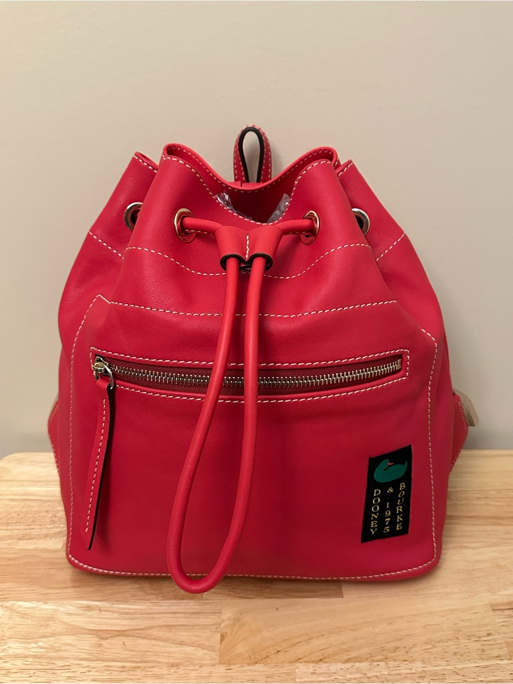 Dooney & Bourke Bright Red Drawstring Backpack with Dooney & Bourke Logo Patch